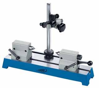 0763 Universal measuring support Column and transverse arm are chrome finished Heavy base plate with prismatic base and T-groove Column is moving and can be clamped in the T-groove Mounting clamp: Ø