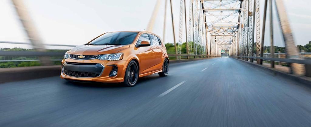 PERFORMANCE 38 MPG 1 HIGHWAY/28 MPG CITY AVAILABLE 1.4L TURBOCHARGED ENGINE 138 HORSEPOWER Sonic Premier RS Hatchback in Orange Burst Metallic (extra-cost color). GO TURBO. The ECOTEC 1.