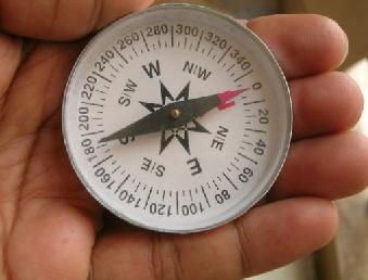 Magnetic compass It is an instrument consisting of base and a needle. The needle has north and south tip whose north tip is painted red (generally).