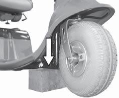 Lift the Strider high enough so that the tyres are no longer touching the floor.