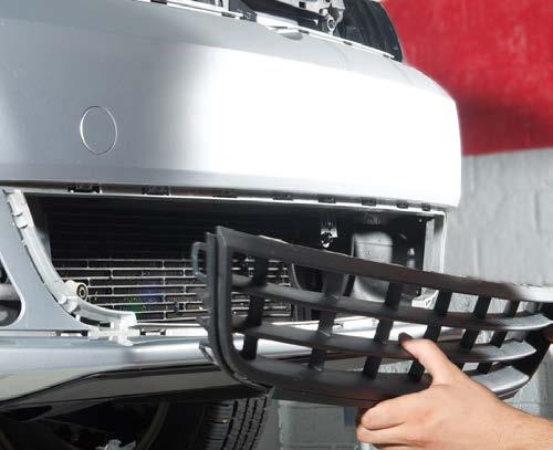Work your way around the outer edge, releasing the plastic snap retainers until the grille comes out. epeat this at the opposite side outer grille.