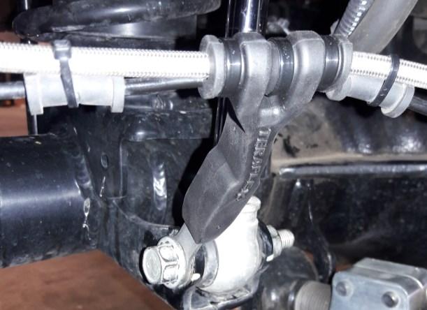 Notes: Use a large screwdriver or pry bar under the shock to help install shock mount bolt.