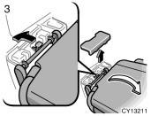 Remove the cover and push the seat lock release lever outward to unlock the seat lock, then pull up the whole seat and remove it. After removing the seat, reinstall the cover.