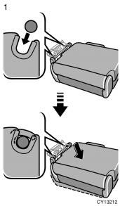 Hold the seat and engage the seat striker to the seat lock, then place the seat on the floor.
