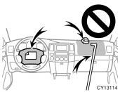 06 06.08 CY13114 Do not put anything or any part of your body on or in front of the dashboard or steering wheel pad that houses the front airbag system.