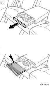 2. To use the rear cup holder, push and pull it out. 3. To use the tray, pull it out.