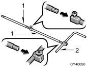 Put a jack handle and jack handle extensions together as shown in the illustration. 1. Jack handle extensions 2.