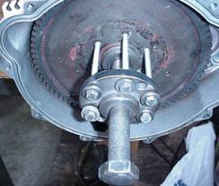 12 (Below) Remove the rubber boot from the PTO flywheel