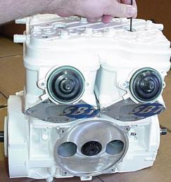 Insert Rotary Assembly Before re-assembly of your new SBT engine, your rotary valve and cover must be inspected and re-timed. (Below) Examine the surface of the valve cover.