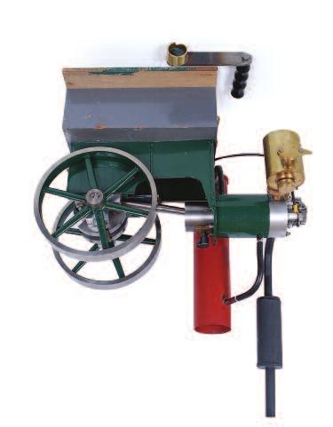 Lot 84 Lot 86 84 1/4 scale petrol driven hit and miss engine, with single cylinder driving geared twin flywheels of 9 inch diameter, brass carburettor and single spark plug, measure 21 inches long,