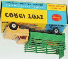 Lot 1662 1662 Corgi Toys, 484 Dodge Kew Fargo livestock transporter, beige cab with grey chassis, green back, spun hubs, 5 plastic animal pigs, in the original blue and yellow box (NM,BVG) 50-80 1663