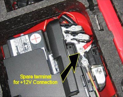 Remove the nut (10mm spanner) and connect the amplifier power lead to the terminal. Replace the nut and tighten. Re-connect your headunit to the loom.