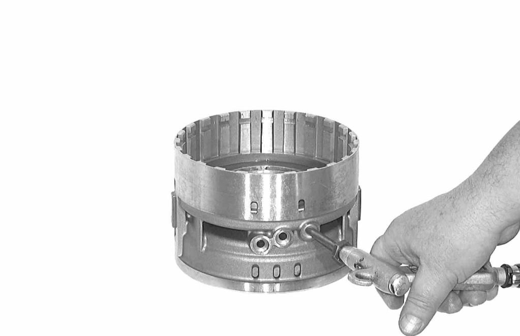 Press out piston D by applying compressed air to the feed bore. Remove the 2 O-ring seals from the piston. Note: If the keys are a firm fit, leave them on the cylinder.