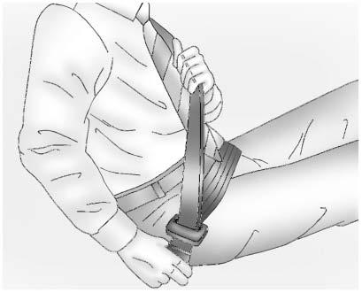 80 SEATS AND RESTRAINTS 5. To make the lap part tight, pull up on the shoulder belt. To unlatch the belt, push the button on the buckle. The belt should return to its stowed position.