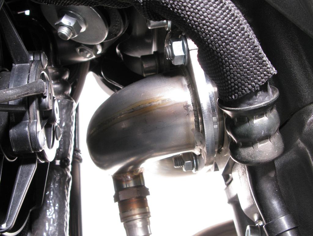 specified torque (Figure 8). WARNING: make sure, not to damage or scratch the brackets, muffler or any other part of the motorcycle!