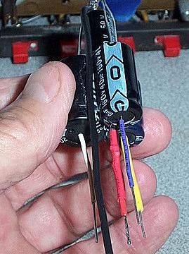 Slip a color length of shrink tubing over each of the four positive leads, making sure that the colors match the colors you choose in