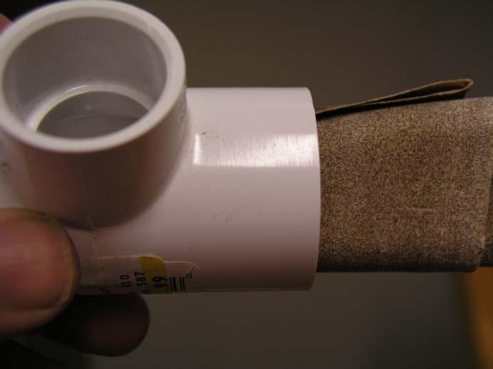 One end of the T connector should be sanded to allow for an easier fit onto the PVC fitting attached to the wood base.