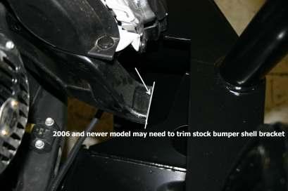 Trim the sheet metal tab in the center which reinforced the stock bumper support (see step 3 and pic on lower right) 4.