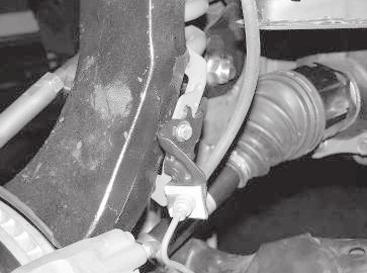 Attach the factory bracket to the new brake line bracket using the supplied ¼ x ¾ bolt,
