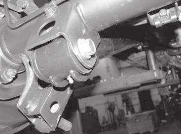 Remove the driver lower link and install an assembled Fabtech link with the gussets facing down