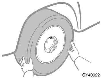 CAUTION Never get under the vehicle when the vehicle is supported by the jack alone. Changing wheels 7. Raise the vehicle high enough so that the spare tire can be installed.