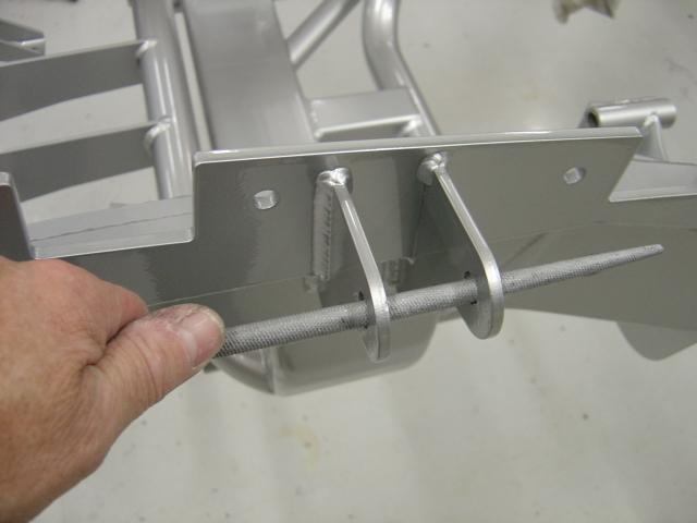 (3) The upper and lower control arms, uprights and hubs are bolted in place.