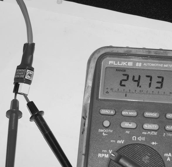 The Display should show a voltage reading (greater than) >18 Volts if functioning properly Power Cable from