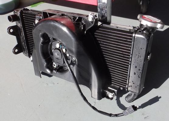 Set the radiator and fan assembly aside as shown in Figure 8.