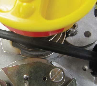 Verify that the flywheel does NOT make contact with the overspeed clock spring in either the untripped (yellow overspeed reset knob in vertical position) or the tripped position (yellow
