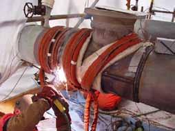 INDUCTION HEATING SYSTEMS Induction Heating Applications Preheating of an in-service pipeline to 100 C before welding on a sleeve Liquid-cooled induction coils are flexible and easy to apply to a