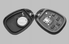 To replace the battery in the remote keyless entry transmitter: Liftgate/Liftglass CAUTION: 1. Insert a thin coin in the slot between the covers of the transmitter housing.