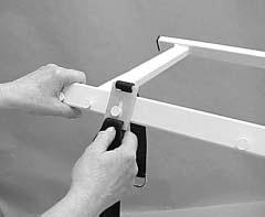 Ultra Care 4000 ATTACHING A STRAP 1. Place the keyhole opening over a post on the spreader-bar assembly and pull the tang down to seat the post in the small end of the keyhole (Figure 13). 2.