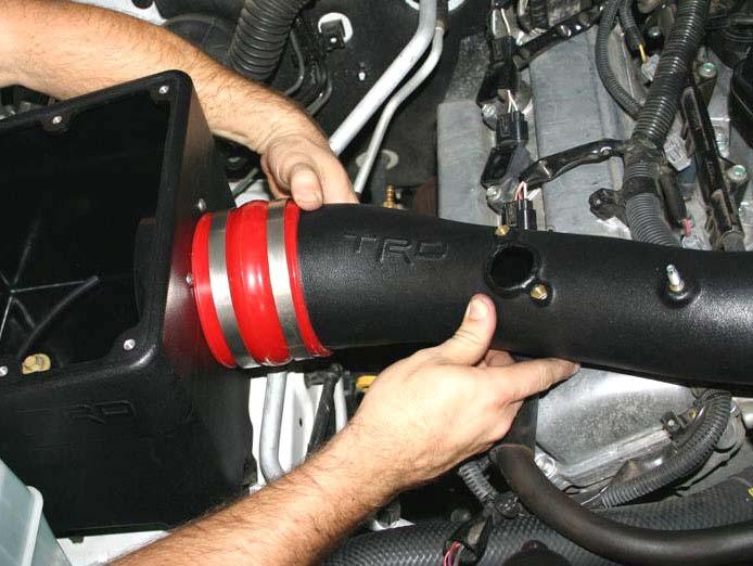 ii. Move large side of TRD intake tube into position and slide large coupler over filter adapter as shown. (Fig. D14) Fig.