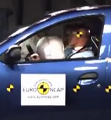 The airbag inflates and hits the dummy in the face, causing injury to the head/neck.