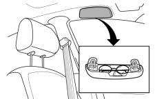Sunglasses Storage Compartment Front Storage Area The sunglasses storage compartment is located above the driver s door.
