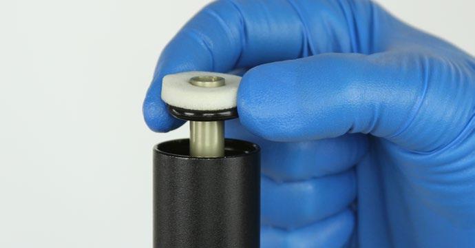 Slide the top cap up until it contacts the lower post threads.