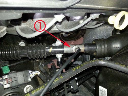 4. This step should be only be used if the vibration can be felt while running the vehicle on the rack. Mount the sensor on the steering shaft (1), under the hood as illustrated above. 5.