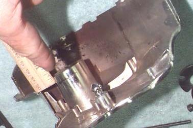 2. First, locate the chrome front sprocket/pulley cover removed in step #7 of the main installation instruction booklet.