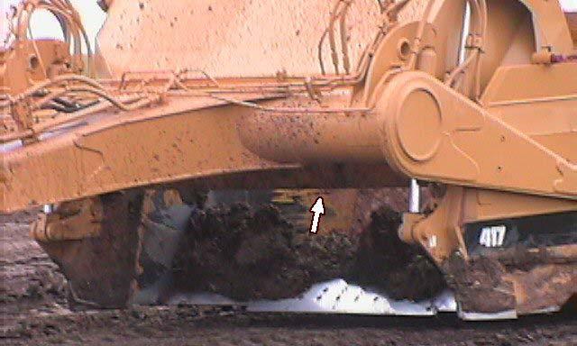 Note: The ejector should always be moved to the rear of the bowl at the finish of dumping the load.