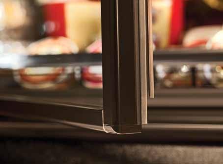 Narrow, full wrap aluminum door rails, thin Vista handle and no center mullions all improve shopper visibility and access.