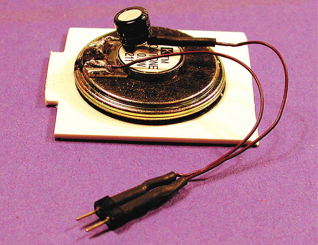 Solder one speaker wire to the solder terminal of the male Microconnector (Photo 9). Solder the other speaker wire to the remaining male Microconnector terminal.