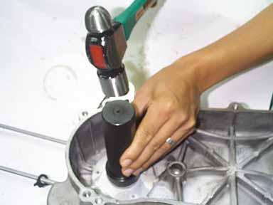 Press-fit the oil seal to specified position with the oil seal