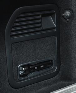 with soft touch interior lining and magnetic button clasps, this convenient stowage system for the rear