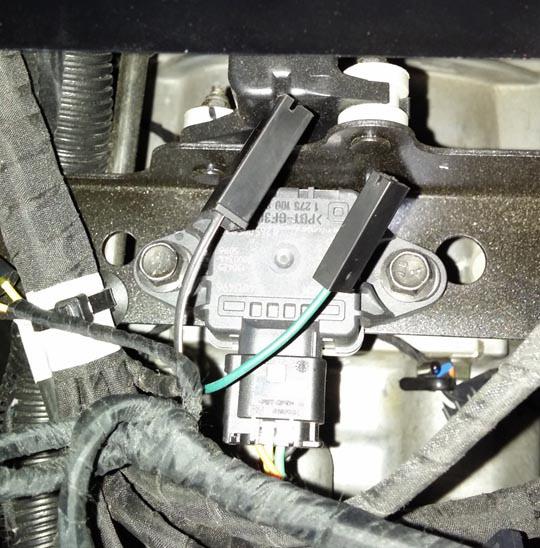 8. Connect ground terminal to the black/ white ground wire plug located inside the center console as indicated in Figure 16. Refer to Figure 9 for ground terminal.