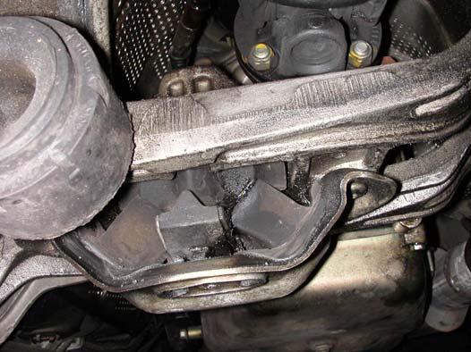 5. Remove the transmission support bracket and shift/electrical cables a.