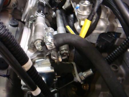 13. 14. Attach the rubber exhaust mounts to turbo Bracket as shown.