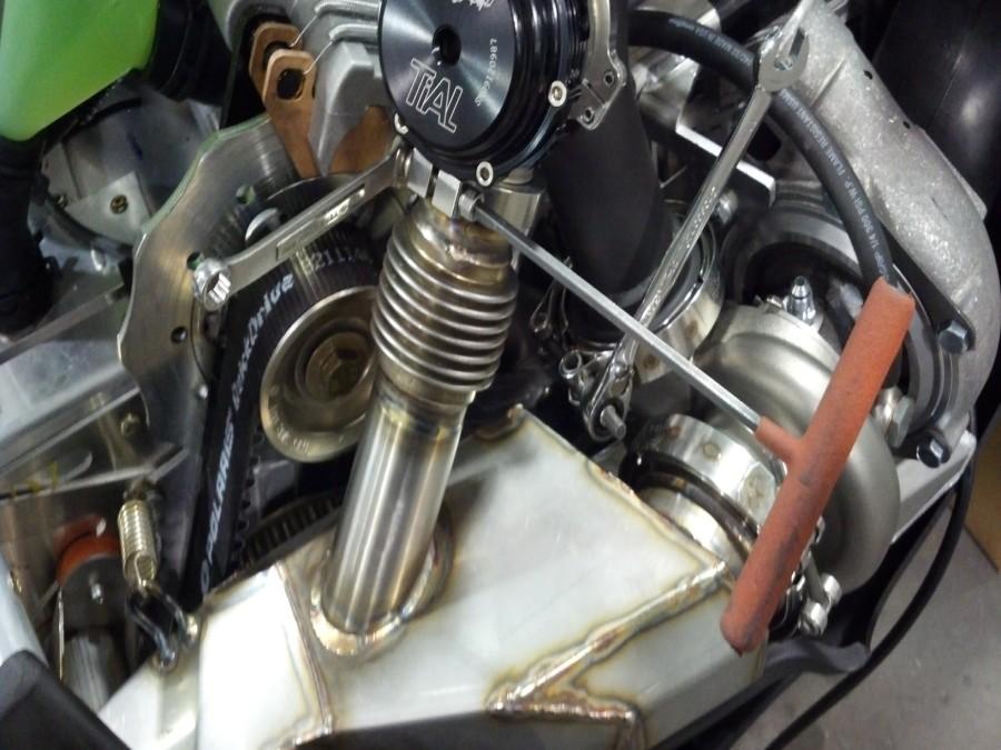 Install stainless muffler into tunnel and attach to turbo using v-band clamp