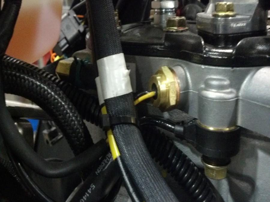 Route fuel line from auxiliary injectors over to fuel line bracket.