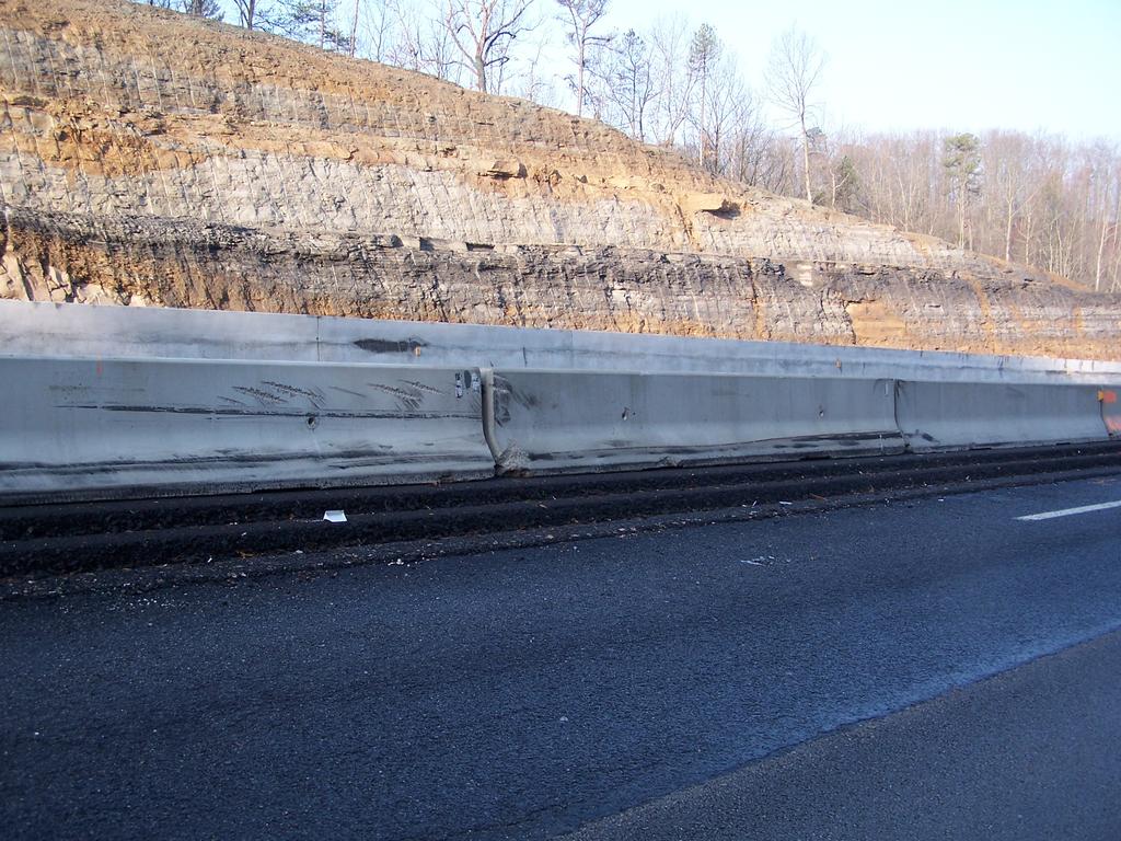 Photograph of the three temporary barrier sections semi driver struck.