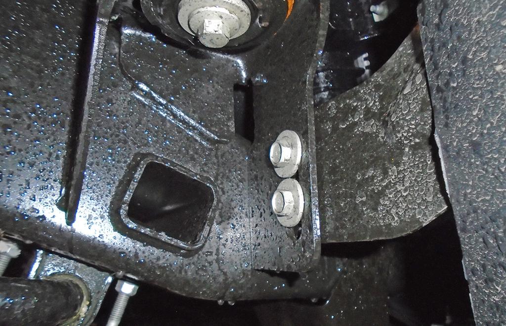 On each side, remove the plastic bolt head covers surrounding the tow hook (Fig.E). 4.